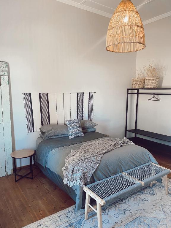 Postel nebo postele na pokoji v ubytování Britskraal Guest Farm