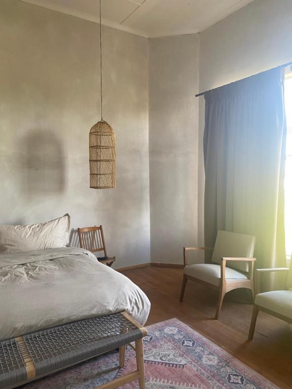 Postel nebo postele na pokoji v ubytování Britskraal Guest Farm