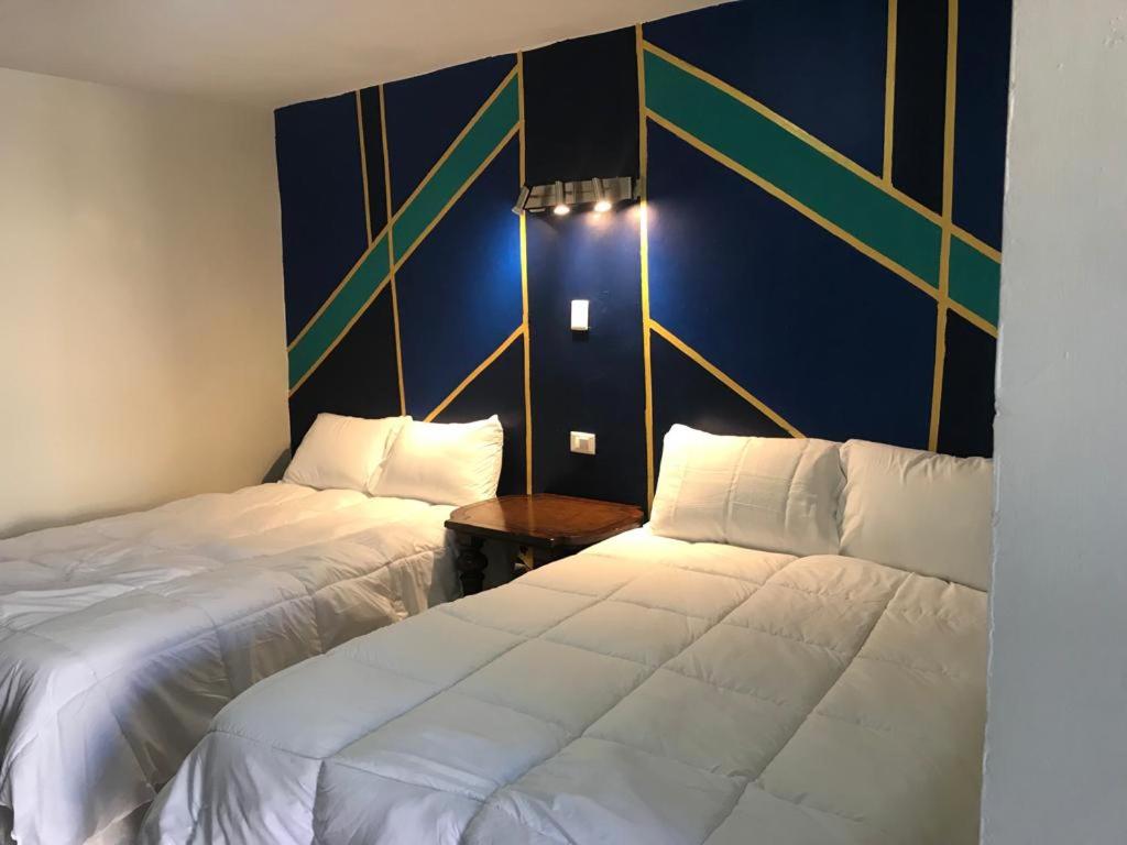 Łóżko lub łóżka w pokoju w obiekcie Yolotl Sleep Experience