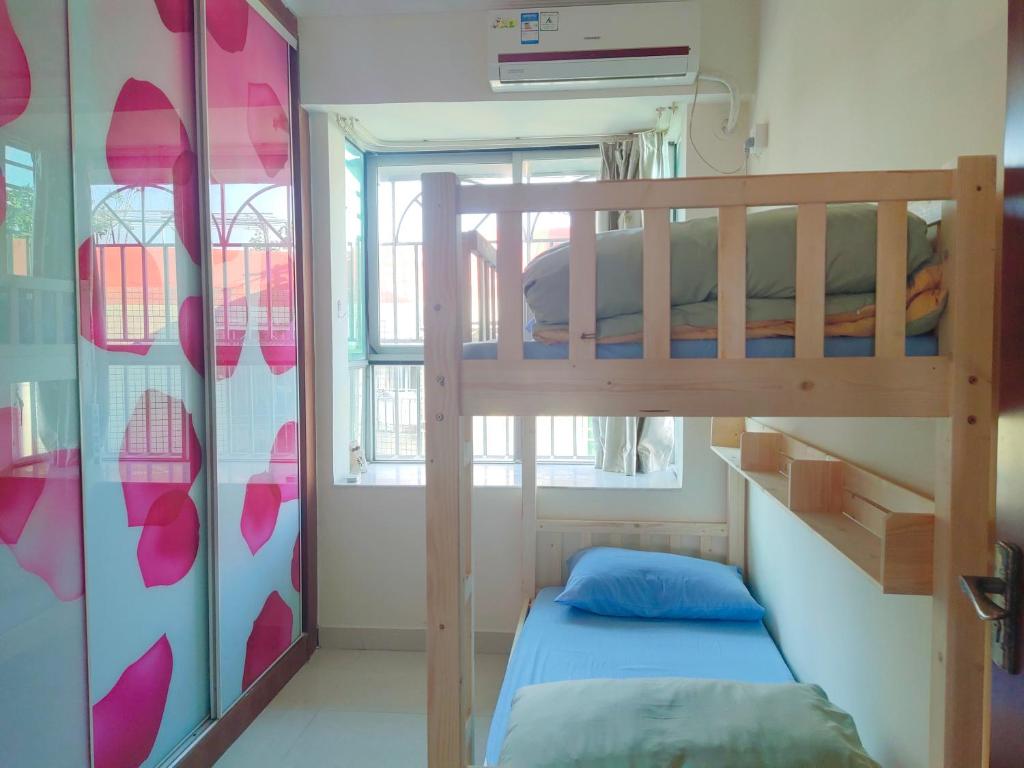 Postel nebo postele na pokoji v ubytování 都市小憩青旅