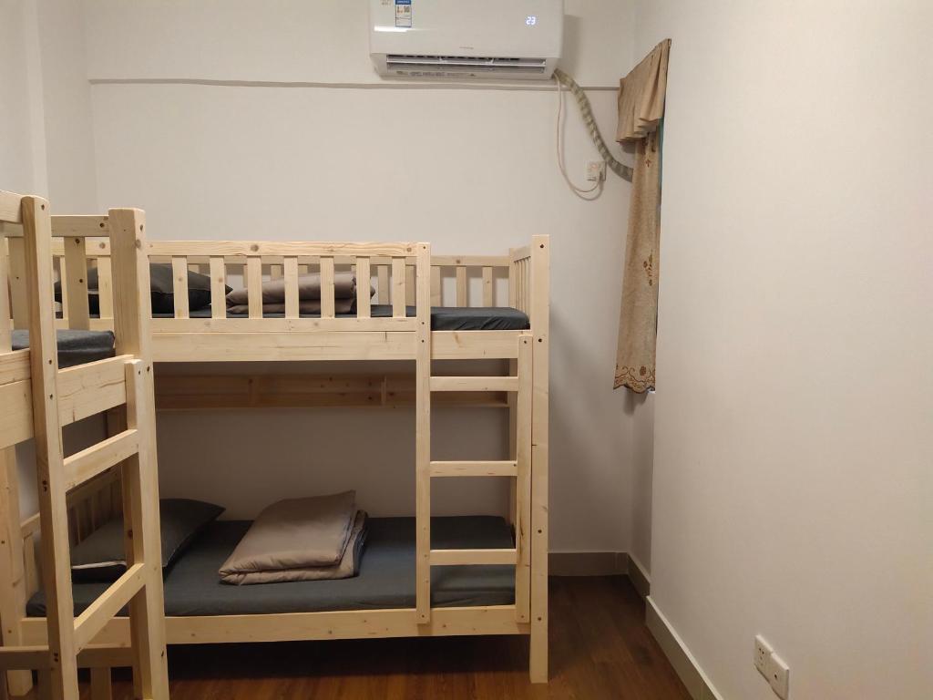 Postel nebo postele na pokoji v ubytování 都市小憩青旅
