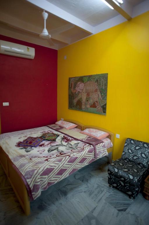 Postel nebo postele na pokoji v ubytování Ganpati Guest House