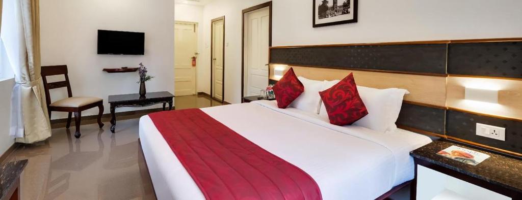 Postel nebo postele na pokoji v ubytování Lemongrass inn munnar