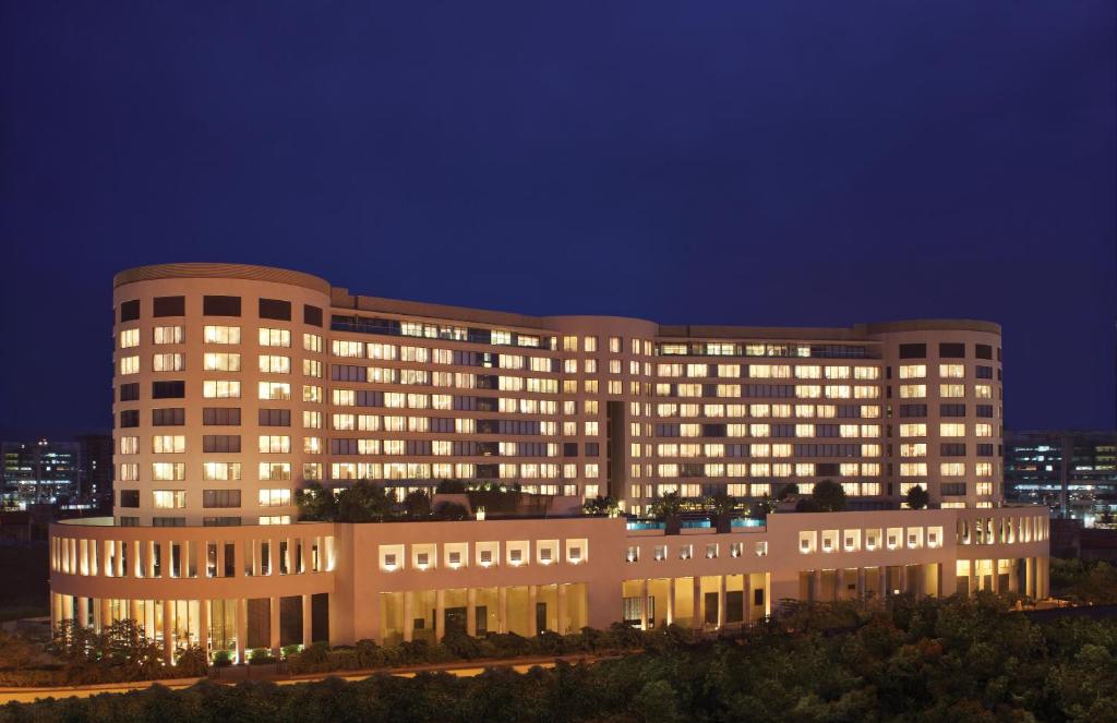 a large building with lights on at night at Trident Bandra Kurla in Mumbai