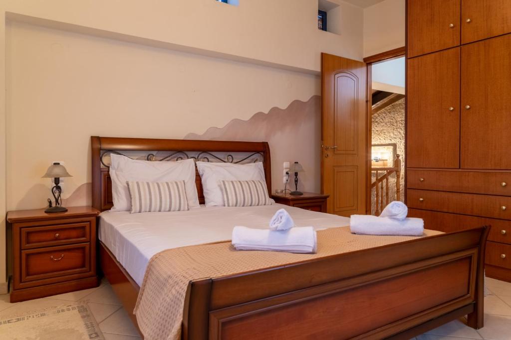 En eller flere senge i et værelse på Μονοκατοικία στο Παλιόκαστρο