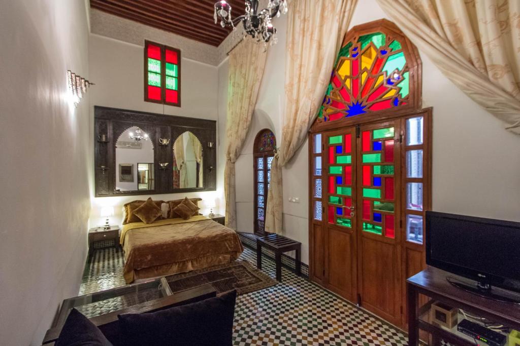 Postel nebo postele na pokoji v ubytování Riad Noujoum Medina