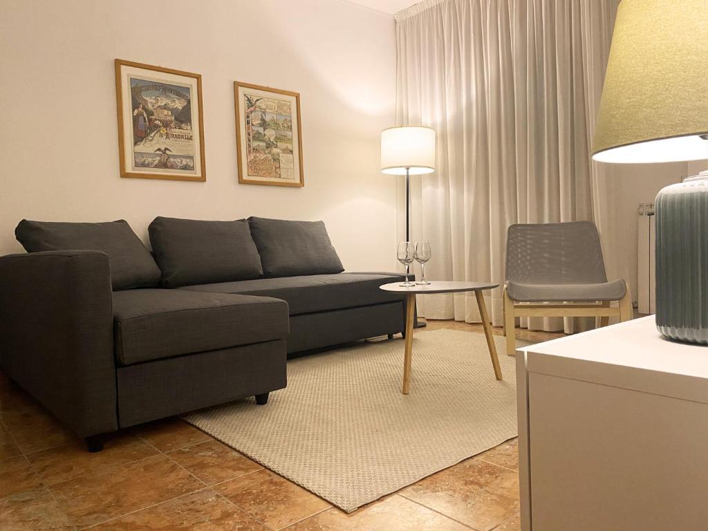a living room with a couch and a chair at Maison Claudio CIR VDA-AOSTA- n 0202 in Aosta