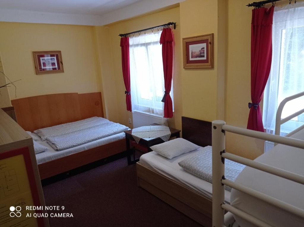 Postel nebo postele na pokoji v ubytování Penzion Poslední míle