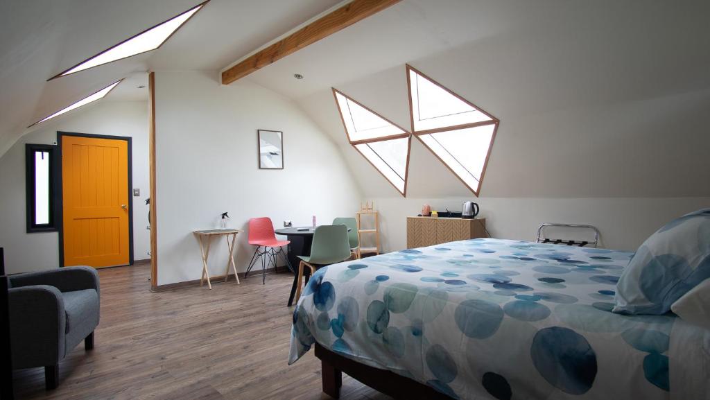 Uma cama ou camas num quarto em Rucatalca Bed and Breakfast