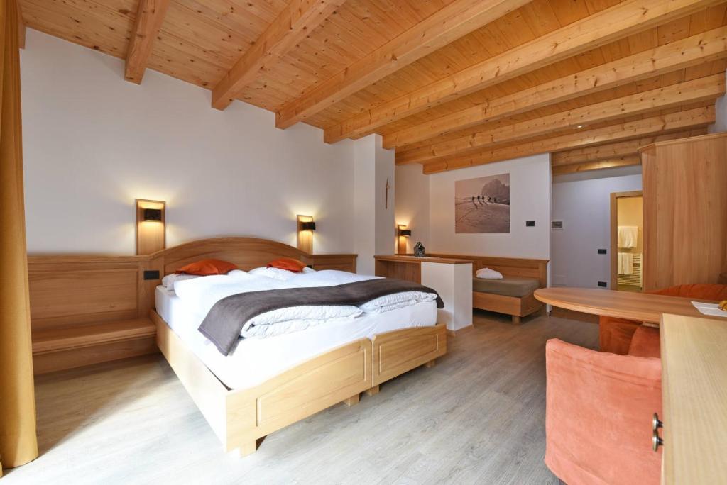 Postel nebo postele na pokoji v ubytování Hotel Brunello