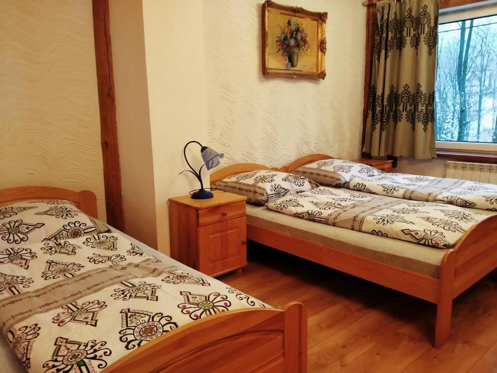 Posteľ alebo postele v izbe v ubytovaní Zajazd Tatrzanski