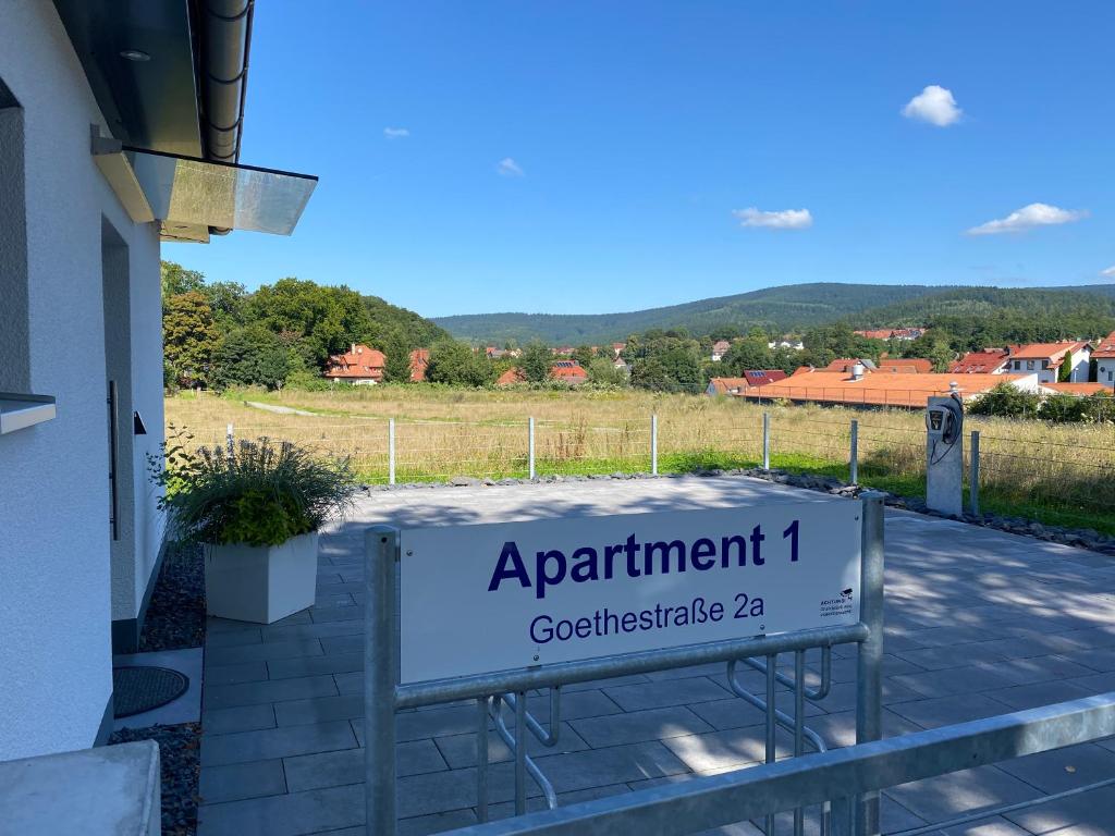 a sign for apartment with a mountain in the background at Apartment 1 in Zella-Mehlis