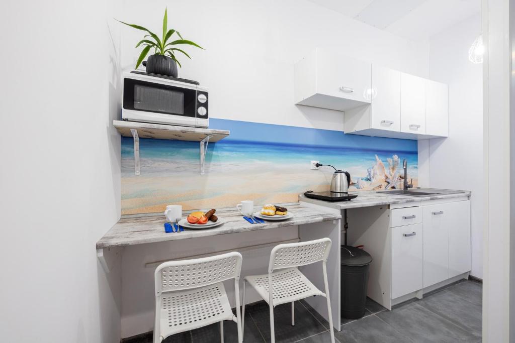 Kuchyň nebo kuchyňský kout v ubytování Pokoje przy Plaży Sopot