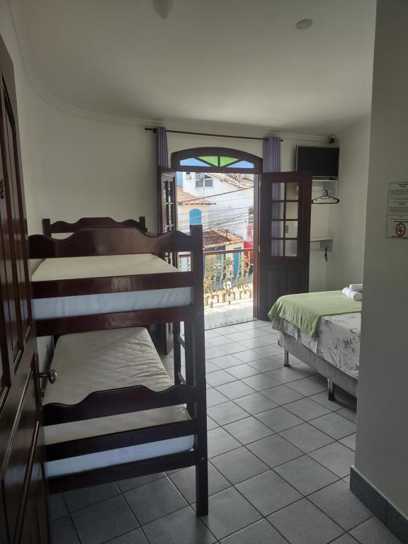 Postel nebo postele na pokoji v ubytování Pousada Caravelas - Centro de Paraty