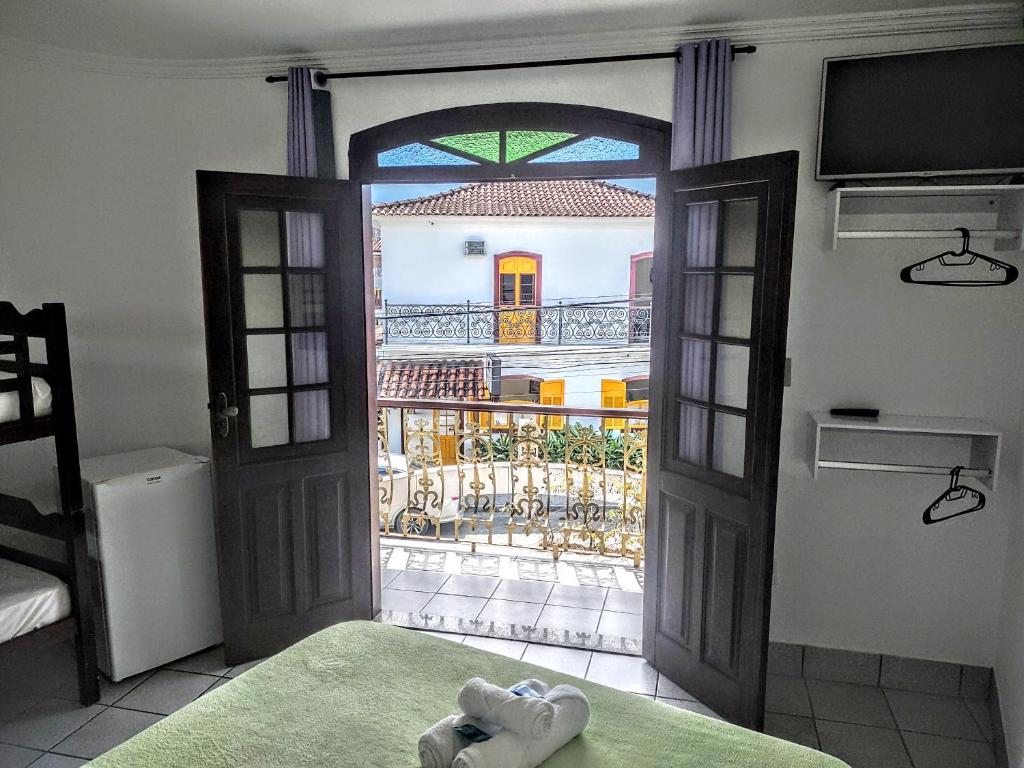Postel nebo postele na pokoji v ubytování Pousada Caravelas - Centro de Paraty