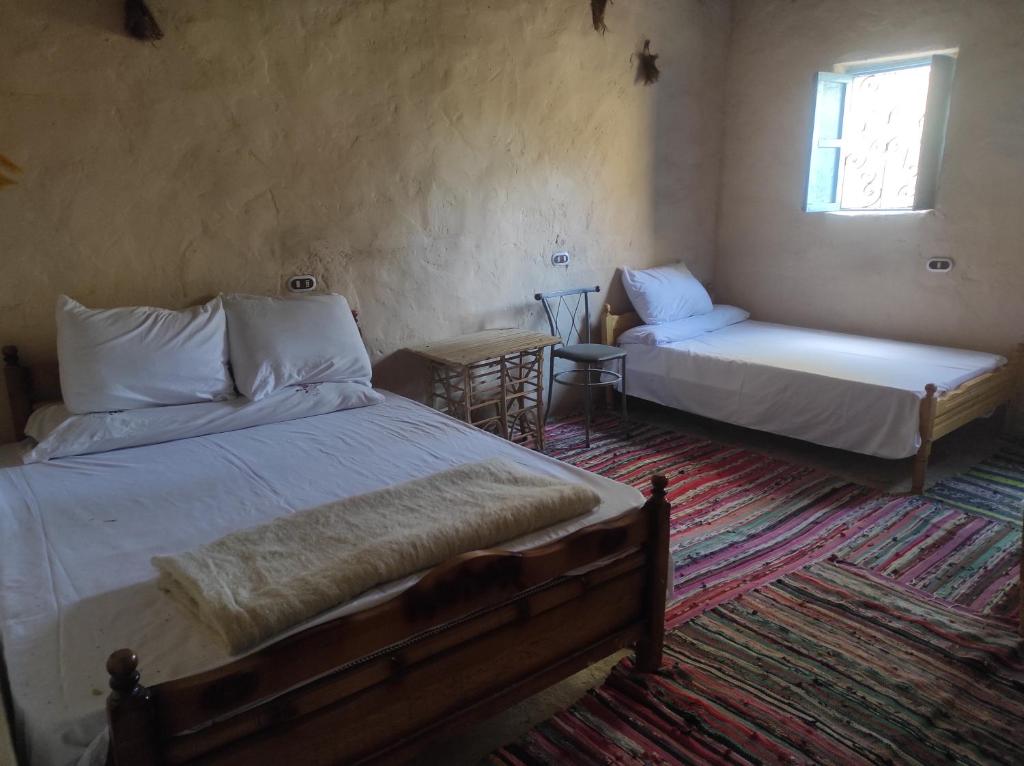 Postel nebo postele na pokoji v ubytování Olive Garden House Siwa