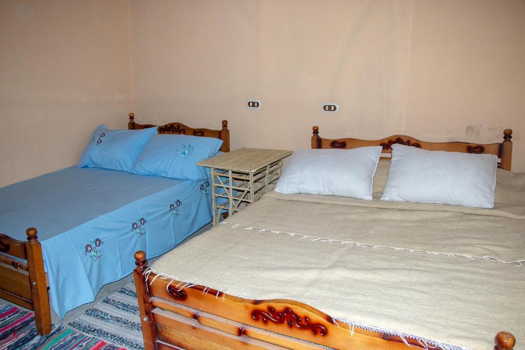 Postel nebo postele na pokoji v ubytování Olive Garden House Siwa