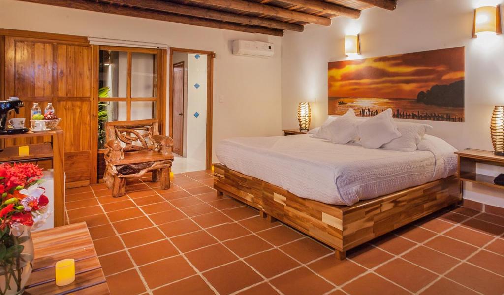 Postel nebo postele na pokoji v ubytování Hotel Punta Faro