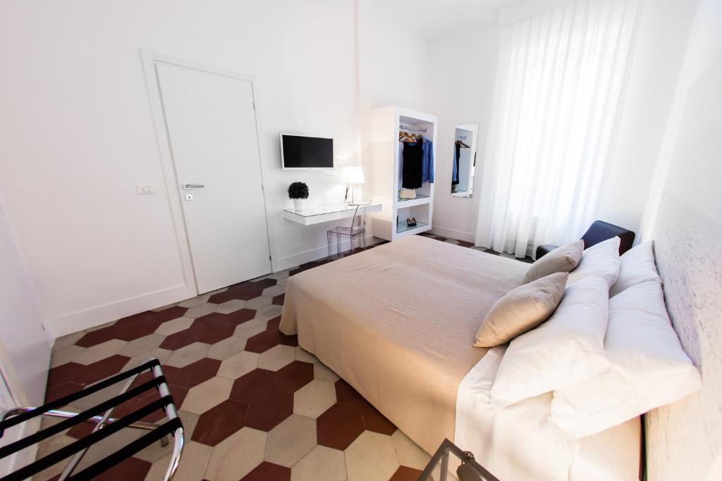 Postel nebo postele na pokoji v ubytování Rhegion B&B