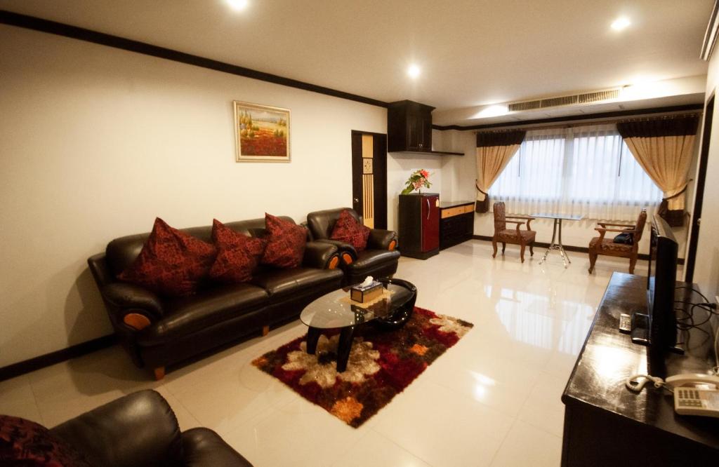 Posezení v ubytování Chiangrai Grand Room Hotel
