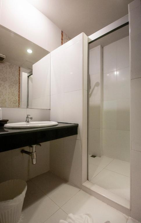 Koupelna v ubytování Chiangrai Grand Room Hotel