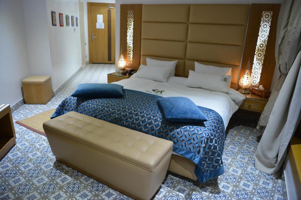 Postel nebo postele na pokoji v ubytování Aralia Boutique Hôtel