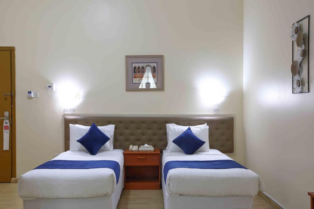 Postel nebo postele na pokoji v ubytování Al Seef Hotel