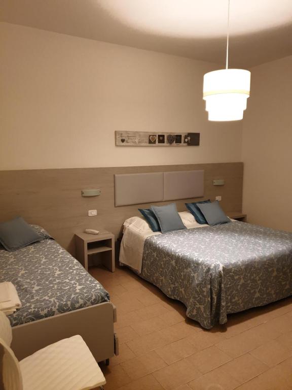 Posteľ alebo postele v izbe v ubytovaní Hotel Lucerna