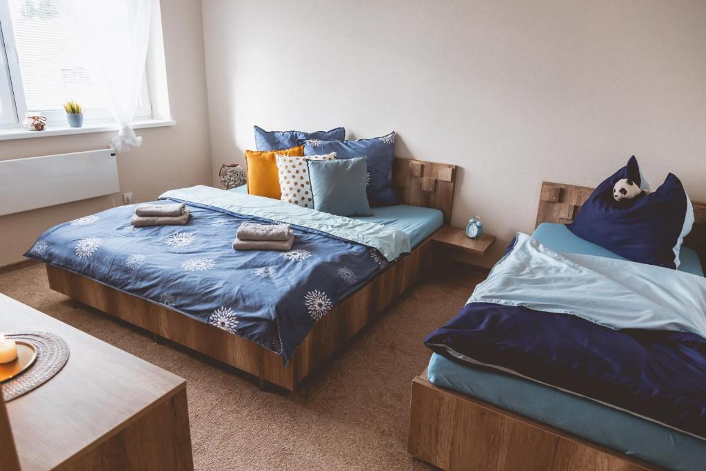 Posteľ alebo postele v izbe v ubytovaní Oli apartments Telgárt