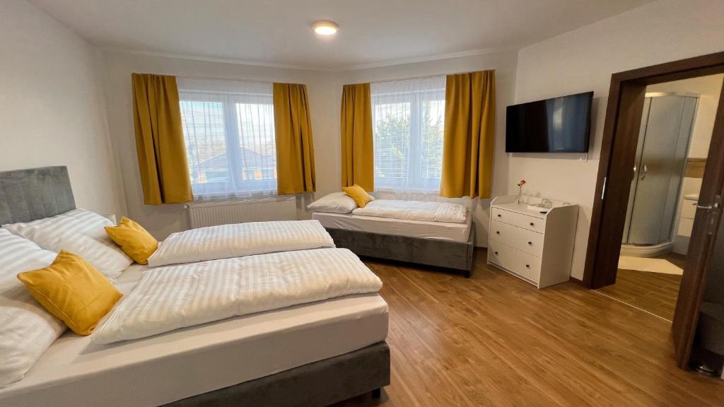 Postel nebo postele na pokoji v ubytování Penzión MELIS