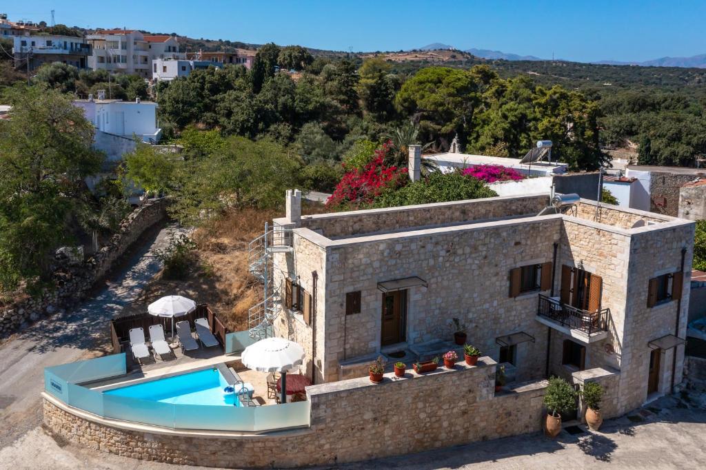 an aerial view of a house with a swimming pool at Marni in Gállos