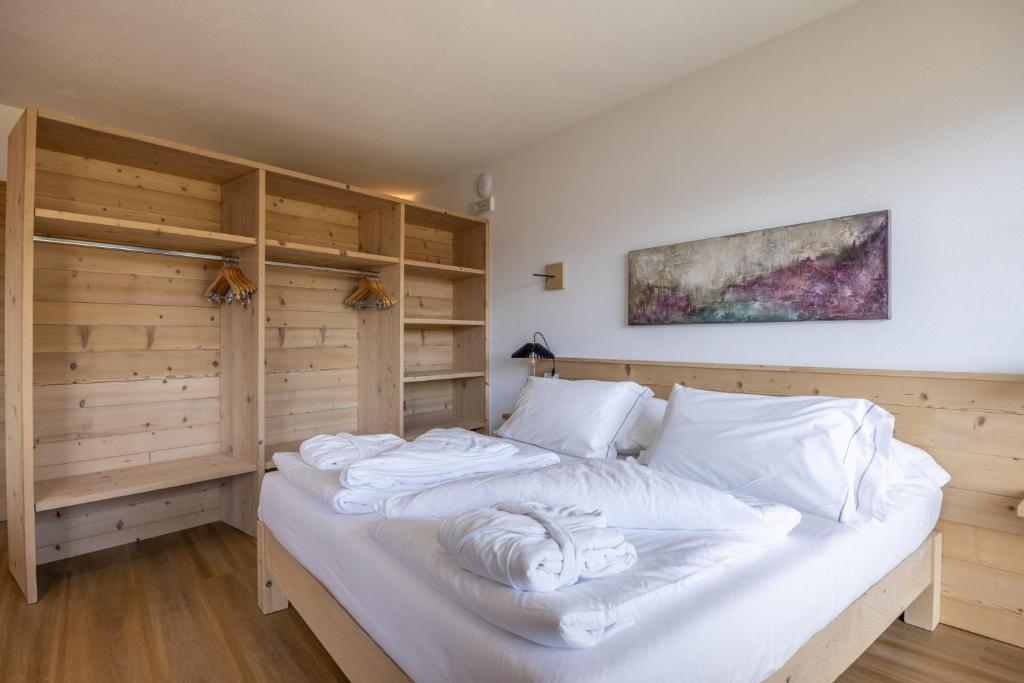 Postel nebo postele na pokoji v ubytování Giallo Dolomiti Wellness