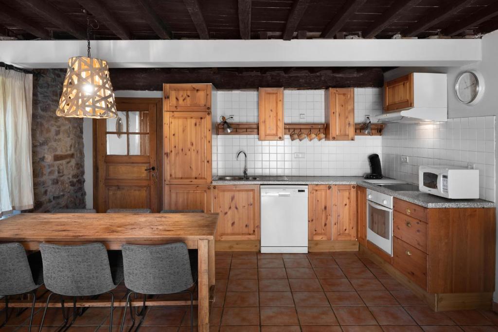 Kuchyň nebo kuchyňský kout v ubytování Hotel Aux Ecuries De La Reine
