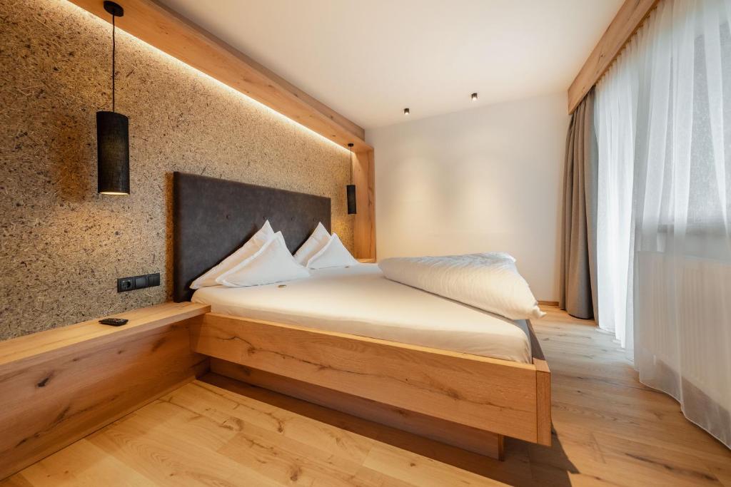 Posteľ alebo postele v izbe v ubytovaní Kräuterhotel Hochzillertal