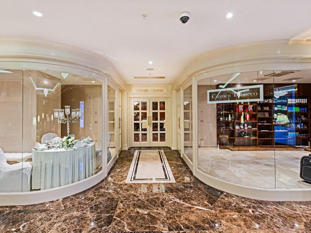 a luxury store with a marble floor and a large window at Elite World Istanbul Florya in Istanbul
