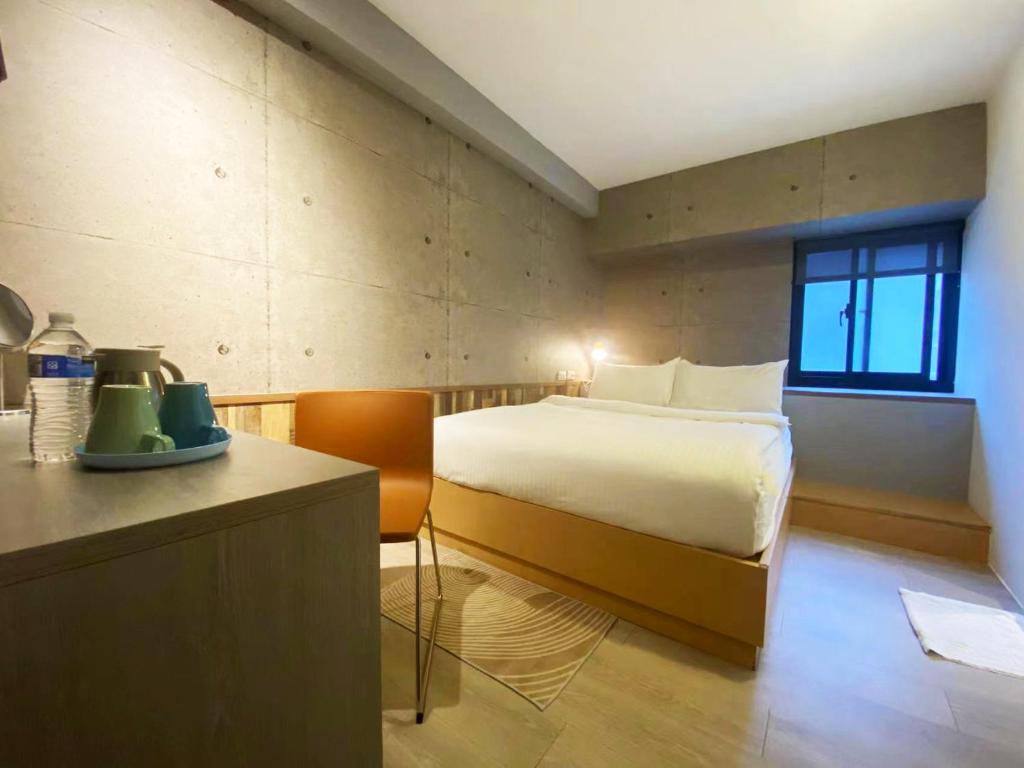 Postel nebo postele na pokoji v ubytování M Taipei Hotel