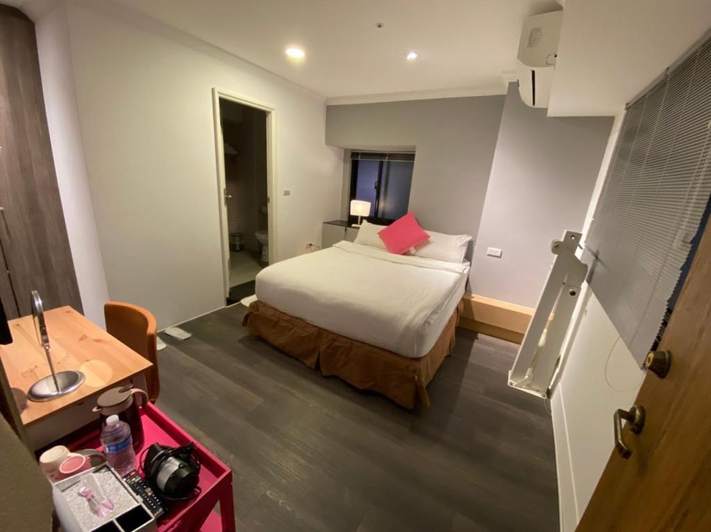 Postel nebo postele na pokoji v ubytování M Taipei Hotel