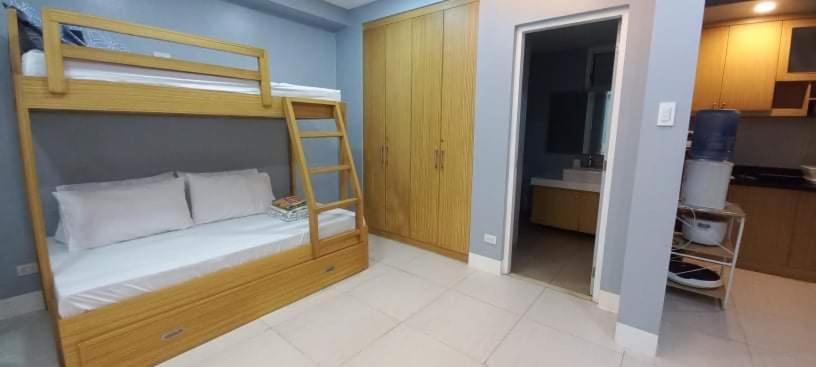 Voodi või voodid majutusasutuse Pico De Loro 2BR toas