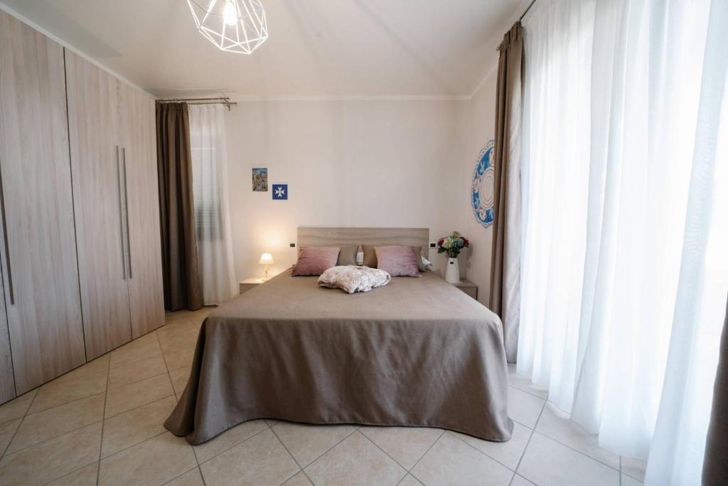 A bed or beds in a room at Agriturismo Tenuta Don Carlo