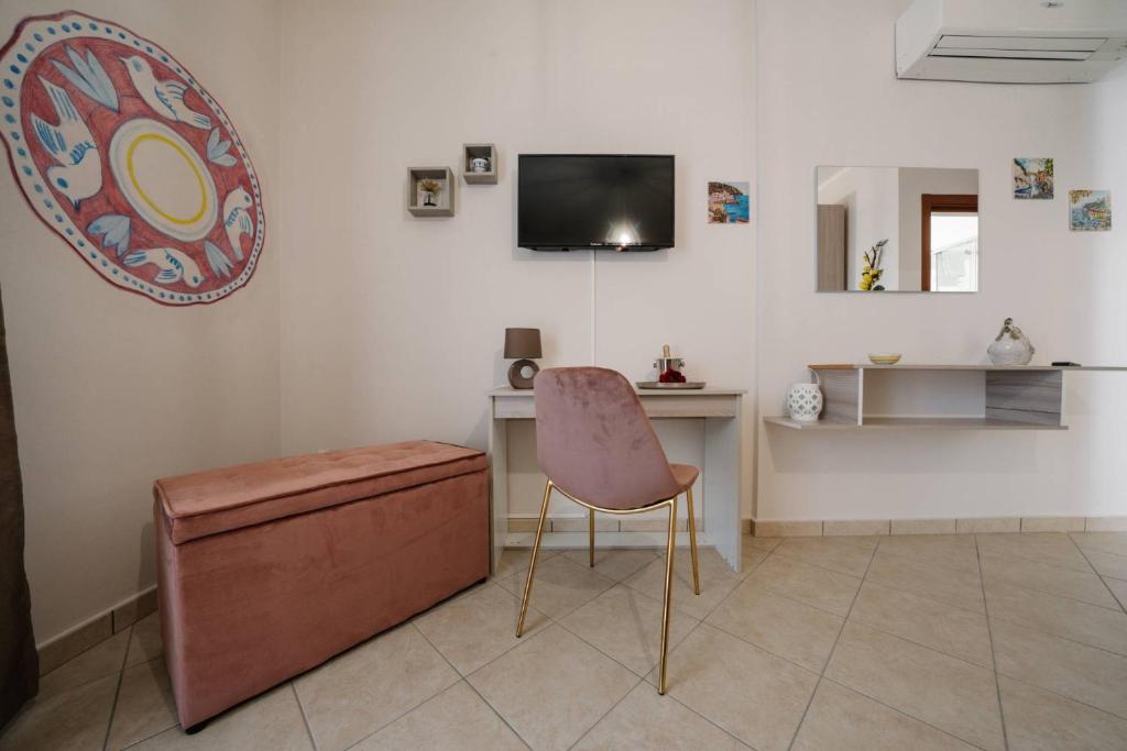A television and/or entertainment centre at Agriturismo Tenuta Don Carlo