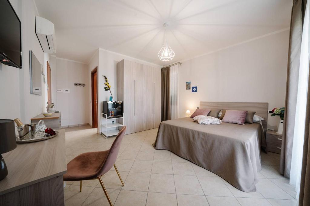 A bed or beds in a room at Agriturismo Tenuta Don Carlo
