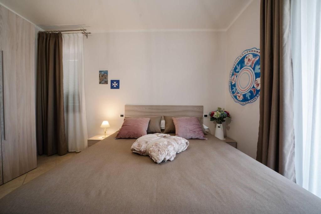 A bed or beds in a room at Agriturismo Tenuta Don Carlo
