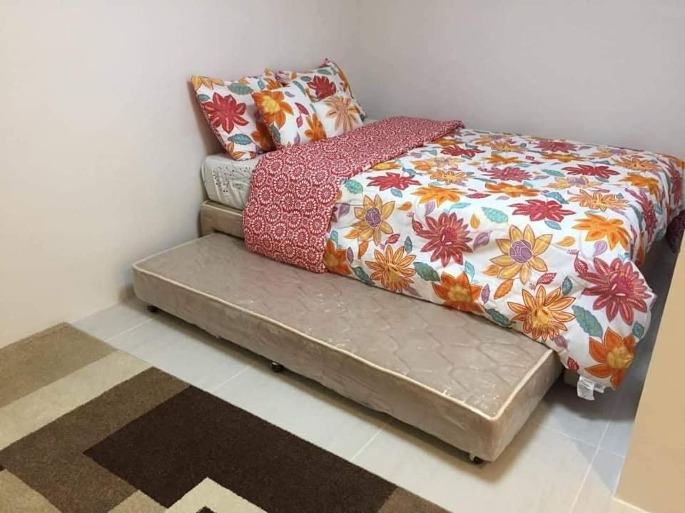 Voodi või voodid majutusasutuse Pico De Loro 2BR toas