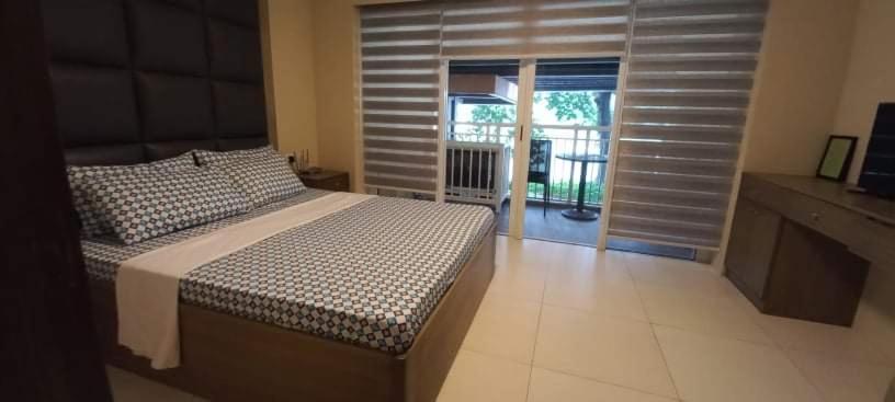 Voodi või voodid majutusasutuse Pico De Loro 2BR toas