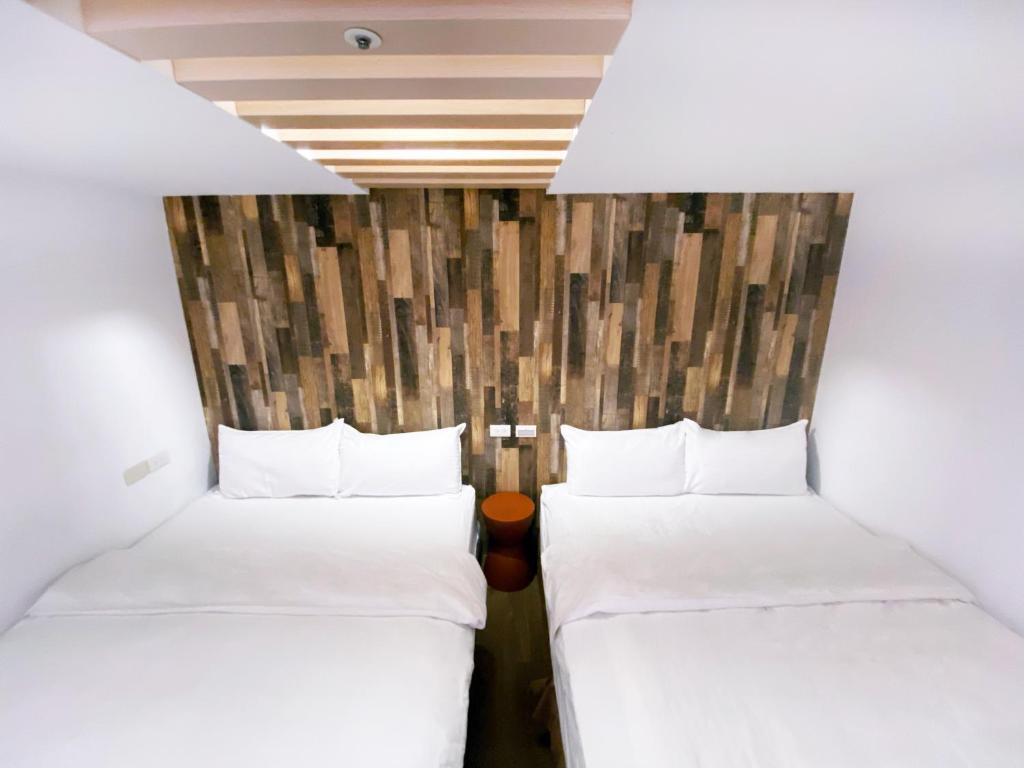 Postel nebo postele na pokoji v ubytování M Taipei Hotel