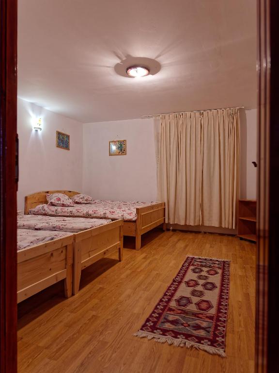 Postel nebo postele na pokoji v ubytování Cabana Fundata