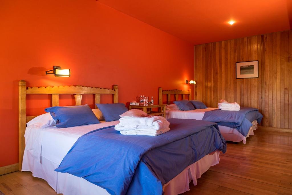 Postel nebo postele na pokoji v ubytování Challhuaquen Lodge