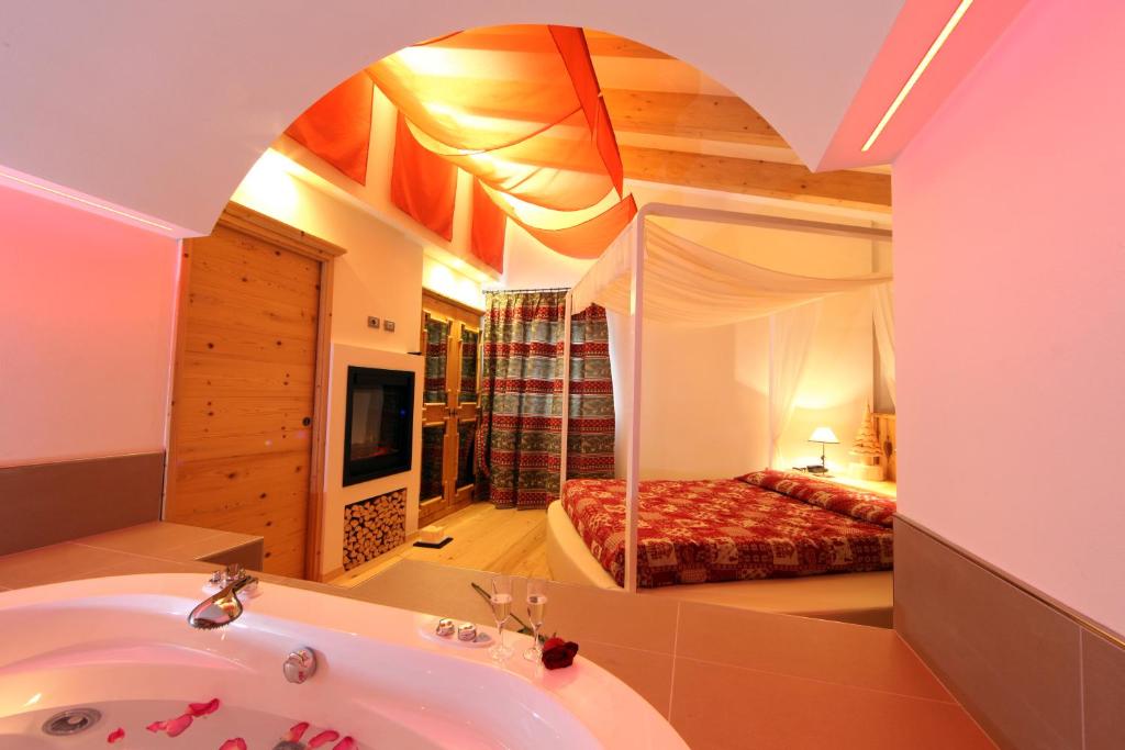 Postel nebo postele na pokoji v ubytování Hotel El Pilon