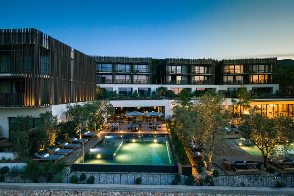 an aerial view of a building with a swimming pool at Maslina Resort in Stari Grad