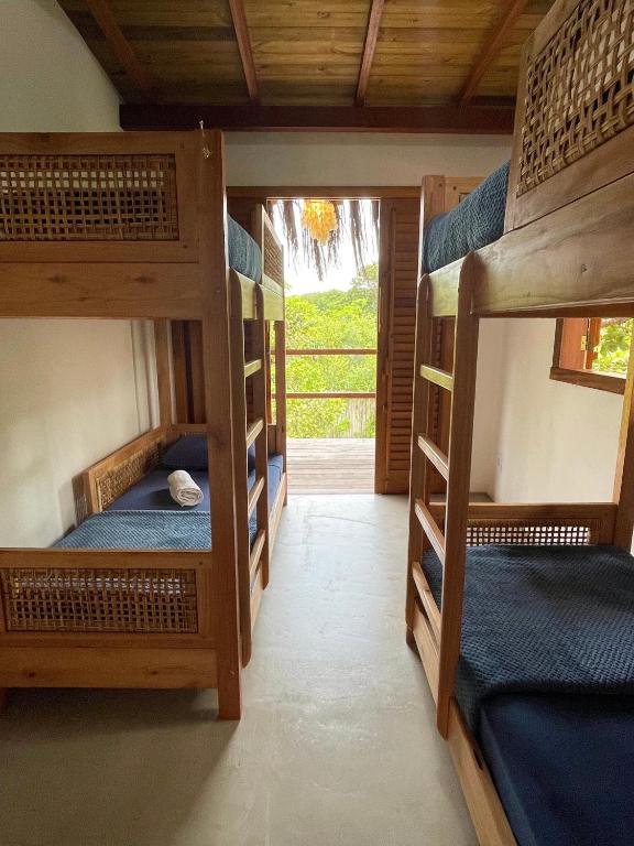 Postel nebo postele na pokoji v ubytování Vulva Caraíva Hostel e Pousada para Mulheres